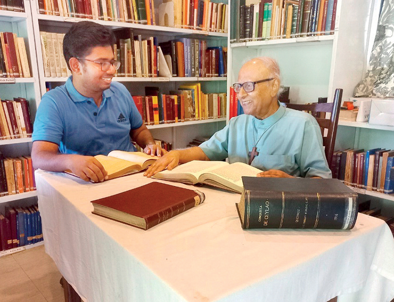 Fr Aloys and the writer at the SG Perera Memorial Library, 2023. Photographed by Robert Crusz